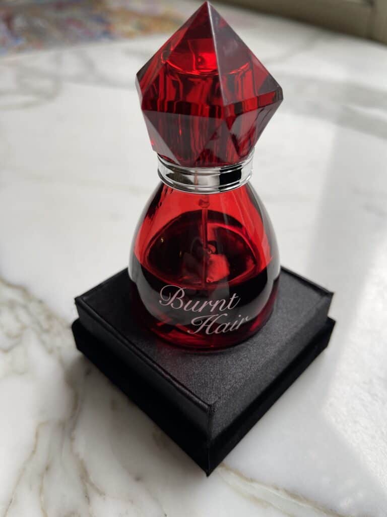 Article: What Does Burnt Hair Perfume Smell Like? Image Shows Bottle Of Burnt Hair Perfume